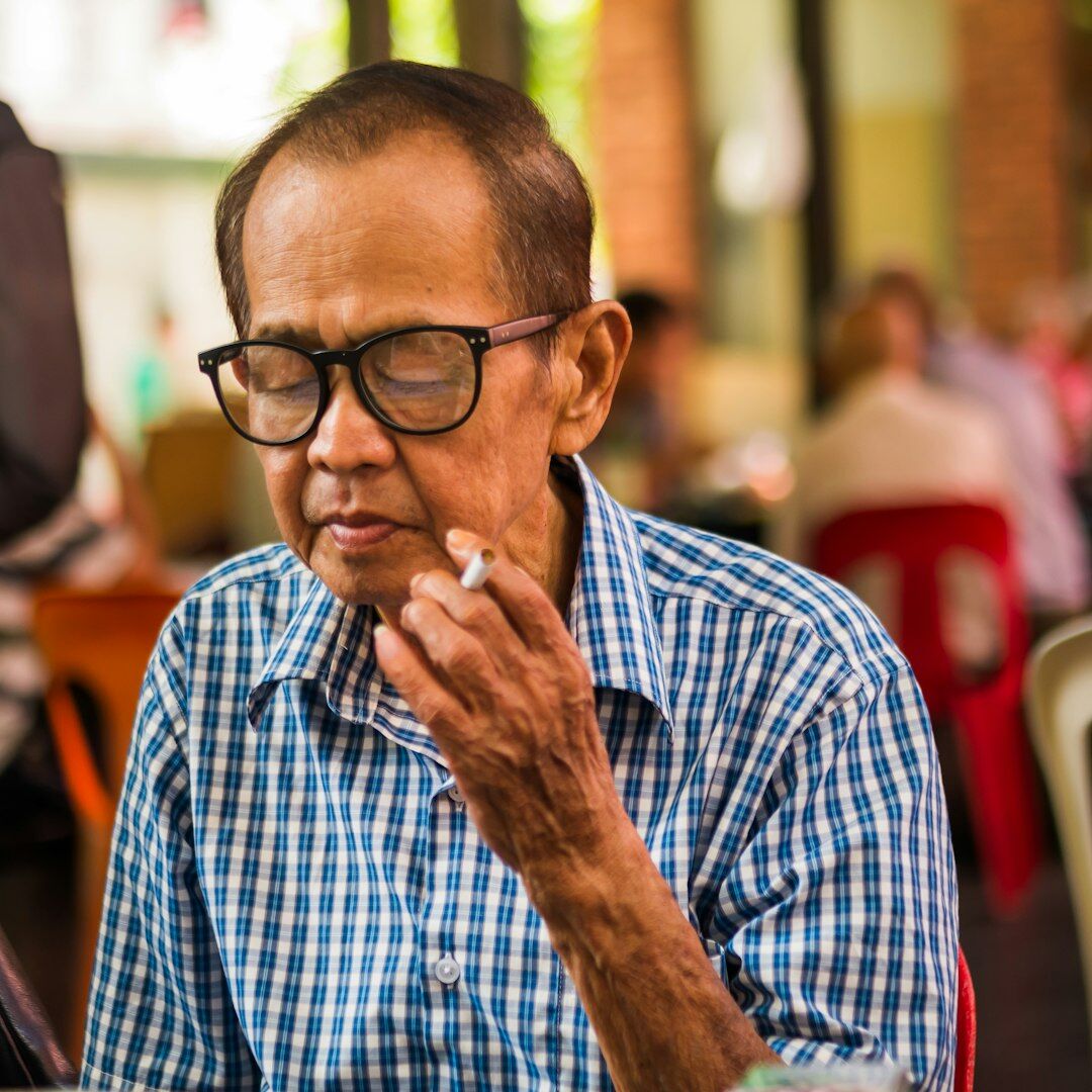 Senior technology analyst with glasses